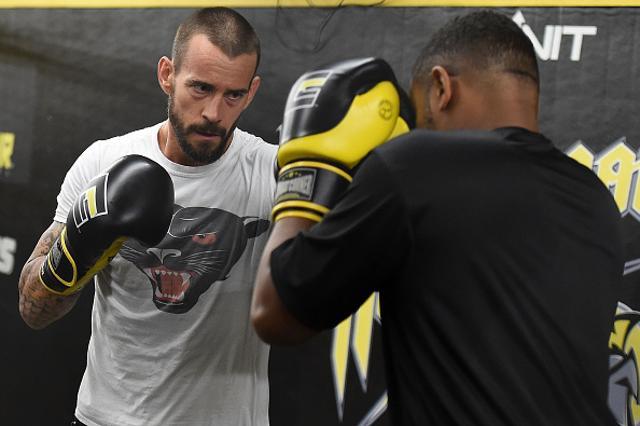 CM Punk (L) spars with Mike "Biggie" Rhodes (R) during a training session. (AFP Photo) CM Punk (L) spars with Mike "Biggie" Rhodes (R) during a training session. (AFP Photo)