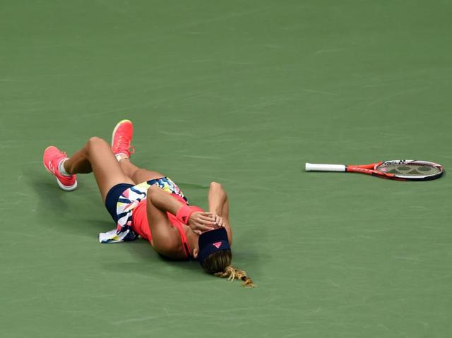 Kerber falls to the ground in celebration after Pliskova’s last shot goes out. (AFP) Kerber falls to the ground in celebration after Pliskova’s last shot goes out. (AFP)