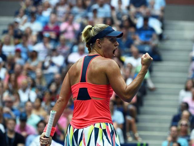 Kerber celebrates winning the first set with a fist pump. (AFP) Kerber celebrates winning the first set with a fist pump. (AFP)