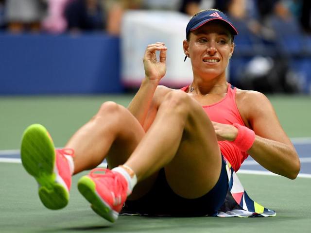 Kerber tears up as she falls to the ground in celebration. (AFP) Kerber tears up as she falls to the ground in celebration. (AFP)