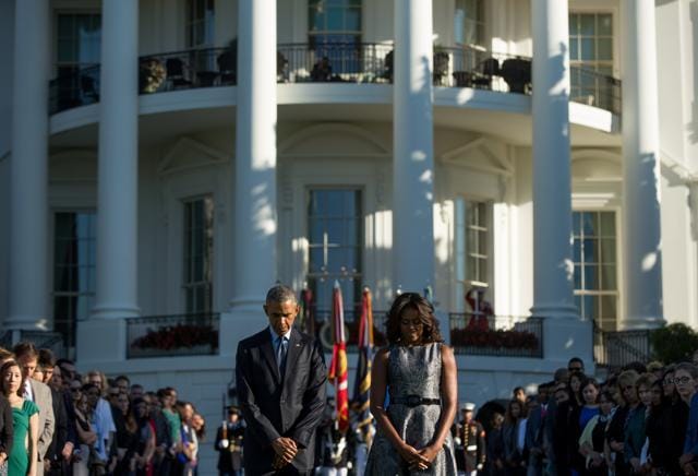 US President Barack Obama, first lady Michelle Obama, pause on the South Lawn of the White House in Washington as they observe a moment of silence to mark the anniversary of the 9/11 attacks last year. (AP File Photo) US President Barack Obama, first lady Michelle Obama, pause on the South Lawn of the White House in Washington as they observe a moment of silence to mark the anniversary of the 9/11 attacks last year. (AP File Photo)