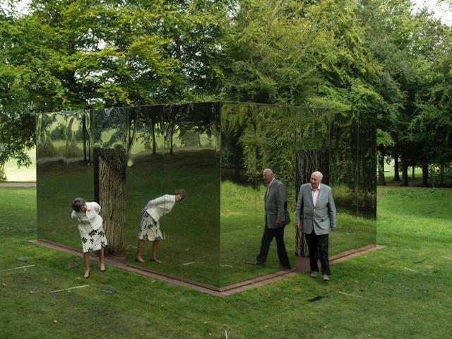 The Duke and the Duchess of Devonshire examine a sculpture by Spanish artist Cristina Iglesias, that features in the 'Beyond Limits' exhibition held near Bakewell, northern England, on Friday. (AFP) The Duke and the Duchess of Devonshire examine a sculpture by Spanish artist Cristina Iglesias, that features in the 'Beyond Limits' exhibition held near Bakewell, northern England, on Friday. (AFP)