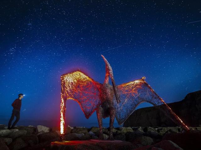 A wire sculpture of a pterosaur by artist Emma Stothard, installed as part of the Staithes Festival of Arts and Heritage in North Yorkshire, England, on Saturday. Over 100 artists exhibited in pop-up galleries all around the village during the two-day festival that concluded on Sunday. (AP) A wire sculpture of a pterosaur by artist Emma Stothard, installed as part of the Staithes Festival of Arts and Heritage in North Yorkshire, England, on Saturday. Over 100 artists exhibited in pop-up galleries all around the village during the two-day festival that concluded on Sunday. (AP)
