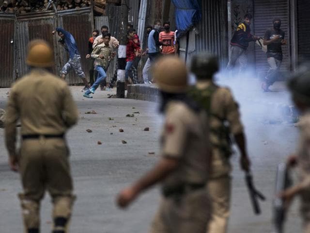 Kashmir protesters face off with policemen in Srinagar during the curfew in August that followed the killing of a militant commander in July. Protests erupted over the civilian deaths and injuries that occurred during these clashes. (AP File Photo) Kashmir protesters face off with policemen in Srinagar during the curfew in August that followed the killing of a militant commander in July. Protests erupted over the civilian deaths and injuries that occurred during these clashes. (AP File Photo)
