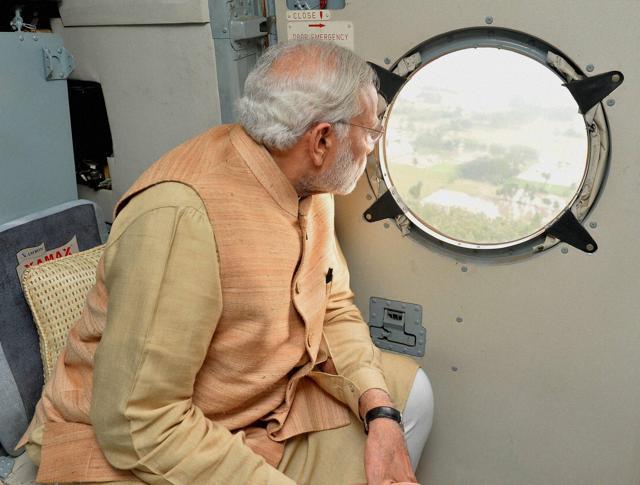 The Press Information Bureau had released this photograph of Prime Minister Narendra Modi conducting an aerial survey of rain hit areas of Chennai last December. It was later revealed that the image had been doctored. (PTI) The Press Information Bureau had released this photograph of Prime Minister Narendra Modi conducting an aerial survey of rain hit areas of Chennai last December. It was later revealed that the image had been doctored. (PTI)