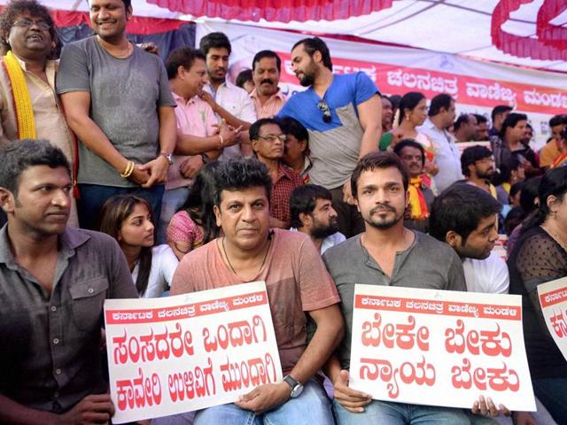 Kannada film industry actors sit protest during the bandh against the Supreme Court’s verdict on Cauvery water release to Tamil Nadu, in Bengaluru. (PTI File Photo) Kannada film industry actors sit protest during the bandh against the Supreme Court’s verdict on Cauvery water release to Tamil Nadu, in Bengaluru. (PTI File Photo)