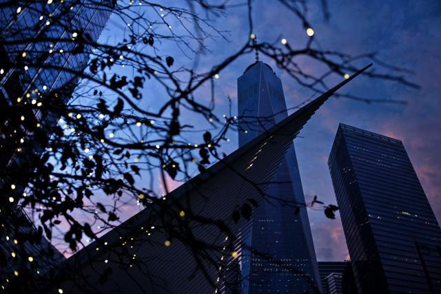 The setting sun is reflected off One World Trade Center and the World Trade Center PATH station at Ground Zero, the night before the 15th anniversary of the September 11, 2011 terrorist attacks. (AFP Photo) The setting sun is reflected off One World Trade Center and the World Trade Center PATH station at Ground Zero, the night before the 15th anniversary of the September 11, 2011 terrorist attacks. (AFP Photo)