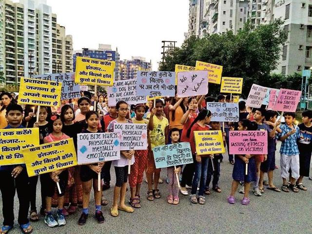Around 300 to 400 residents of Aditya Mega city and nearby highrises staged a candlelight march in Indirapuram against the growing stray dog menace in their area. (HT Photo) Around 300 to 400 residents of Aditya Mega city and nearby highrises staged a candlelight march in Indirapuram against the growing stray dog menace in their area. (HT Photo)