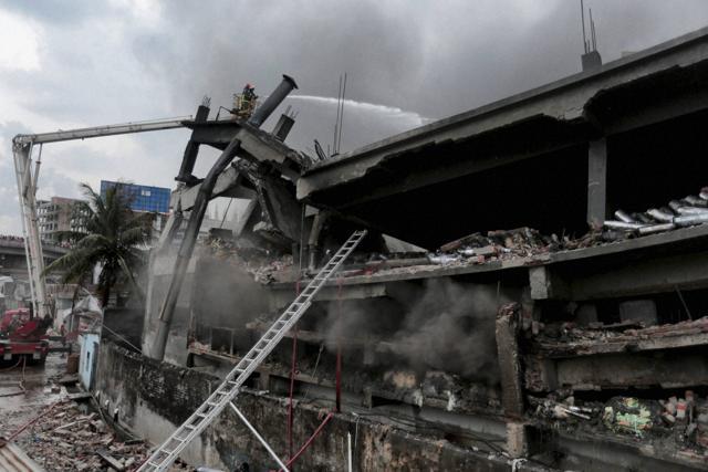 Firefighters work to put out a fire at Tampaco Foils Ltd. factory in Tongi industrial area outside Dhaka, Bangladesh, on September 11, 2016. (AP) Firefighters work to put out a fire at Tampaco Foils Ltd. factory in Tongi industrial area outside Dhaka, Bangladesh, on September 11, 2016. (AP)