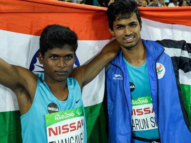 India's Mariyappan Thangavelu (L) and Bhati Varun Singh celebrate their gold and bronze medals.(AFP Photo)