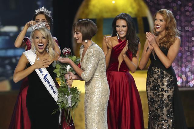 The outgoing Miss America, Betty Cantrell (left), crowns the Miss America winner Miss Arkansas Savvy Shields, while Lynn Weidner (third right), assists, as Miss Maryland Hannah Brewer (second right) and Miss Texas 2016 Caroline Carothers look on during the Miss America 2017 pageant. (AP) The outgoing Miss America, Betty Cantrell (left), crowns the Miss America winner Miss Arkansas Savvy Shields, while Lynn Weidner (third right), assists, as Miss Maryland Hannah Brewer (second right) and Miss Texas 2016 Caroline Carothers look on during the Miss America 2017 pageant. (AP)