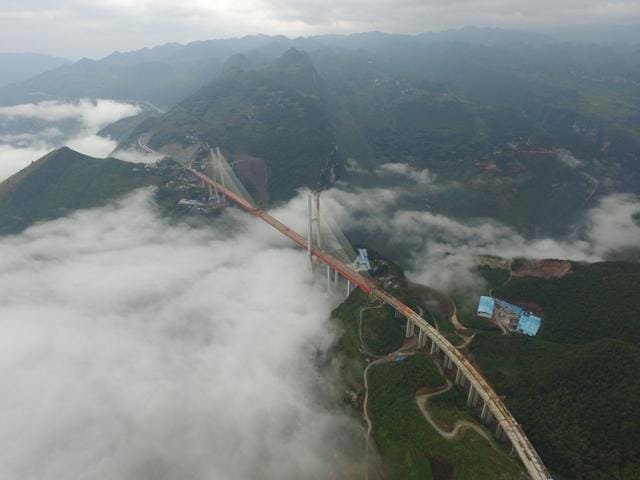 An aerial view of the bridge that will connect two provinces in Bijie, Guizhou Province, China, on September 10, 2016. The construction spans 1341 metres, and is expected to open by the end of 2016. (Reuters) An aerial view of the bridge that will connect two provinces in Bijie, Guizhou Province, China, on September 10, 2016. The construction spans 1341 metres, and is expected to open by the end of 2016. (Reuters)