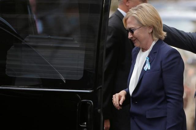 US Democratic presidential candidate Hillary Clinton climbs into her van outside her daughter Chelsea's home in New York after she left ceremonies commemorating the 15th anniversary of the September 11 attacks. (Reuters) US Democratic presidential candidate Hillary Clinton climbs into her van outside her daughter Chelsea's home in New York after she left ceremonies commemorating the 15th anniversary of the September 11 attacks. (Reuters)