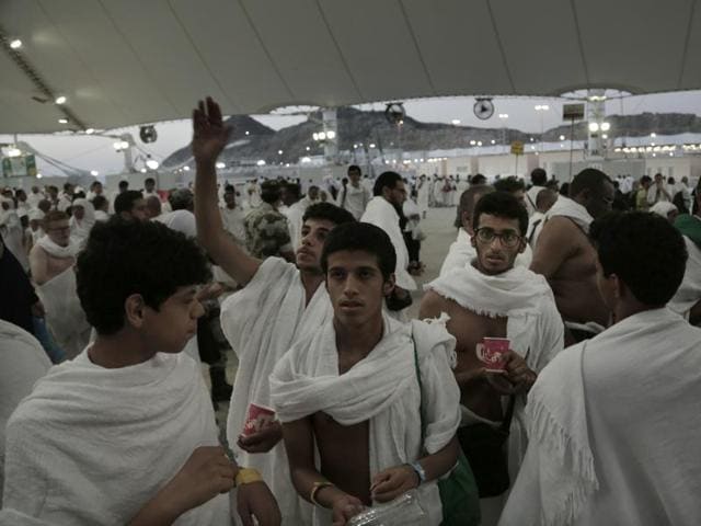 Saudi Muslim pilgrims make their way to cast stones at a pillar symbolising the stoning of Satan, in a ritual called "Jamarat," the last rite of the annual hajj, on the first day of Eid al-Adha, in Mina. (AP Photo)