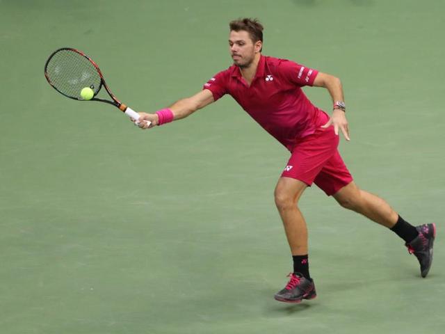 Stan Wawrinka of Switzerland returns a shot to Novak Djokovic of Serbia. (USA Today Sports)