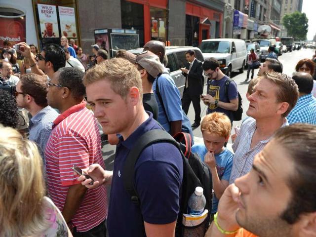 A crowd at the corner of 33rd street and Fifth Avenue in front of the Empire State Building in New York. (AFP file photo) A crowd at the corner of 33rd street and Fifth Avenue in front of the Empire State Building in New York. (AFP file photo)