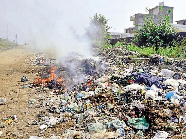 Garbage dumped by residents in an open space near the railway crossing at Verka in Amritsar. (HT Photo) Garbage dumped by residents in an open space near the railway crossing at Verka in Amritsar. (HT Photo)
