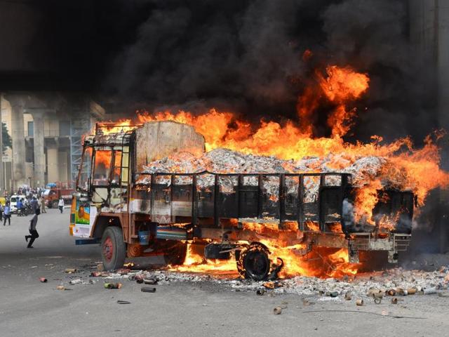 A truck from Tamil Nadu burns after it was set alight by agitated pro-Karnataka activists. (AFP Photo) 