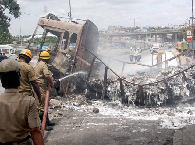 Fire men dousing a torched truck in Bengaluru on Tuesday, Sep 13, 2016, a day after violent protests by pro-Kannada activists over Cauvery water row. (PTI) Fire men dousing a torched truck in Bengaluru on Tuesday, Sep 13, 2016, a day after violent protests by pro-Kannada activists over Cauvery water row. (PTI)