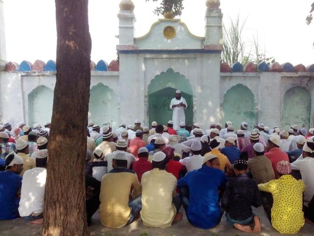 The residents offered prayers at a local mosque and shared sweets to mark Bakr-Eid on Tuesday.(Mayank Rana/HT Photo)