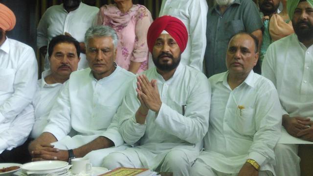 Sunil Jakhar, Chanranjit Singh Channi (in red turban) and Tarlochan Singh Soondh. (Keshav Singh/HT Photo)