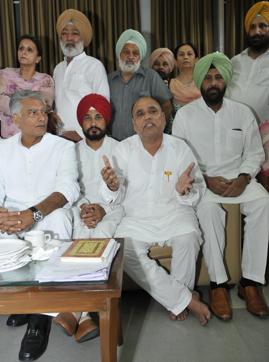 Soondh, without shoes, and other leaders in an interaction with the media at the Punjab assembly in Chandigarh on Wednesday. (Keshav Singh/HT Photo)