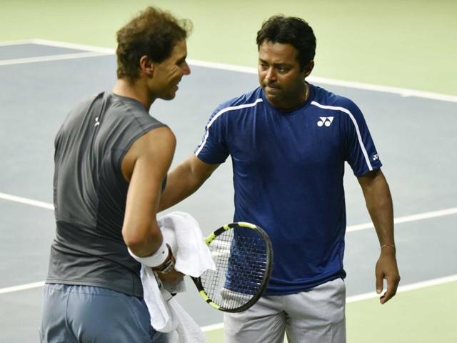 Nadal has a friendly word with India’s Leander Paes. (Vipin Kumar/HT PHOTO)