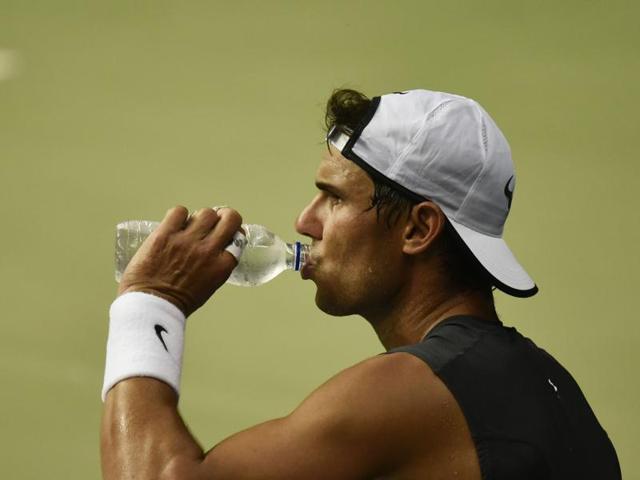 Rafa grabs a drink of water during a break. Despite the evening start chosen to attract more spectators to the stadium, Delhi’s humid conditions will prove a challenge to both teams. (Vipin Kumar/HT PHOTO)