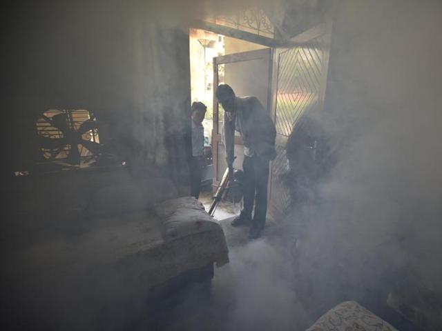 A South Delhi Municipal Corporation worker carries out a fumigation drive in Lajpat Nagar II on Tuesday. (Raj K Raj/HT Photo) A South Delhi Municipal Corporation worker carries out a fumigation drive in Lajpat Nagar II on Tuesday. (Raj K Raj/HT Photo)