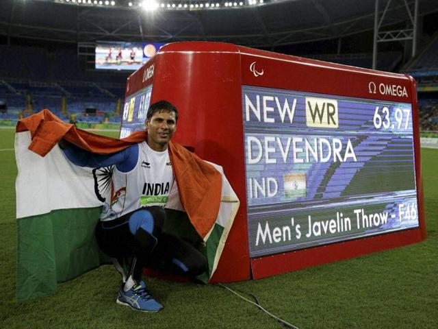 Devendra Jhajharia poses for pictures next to the scoreboard that shows his world record in the men's javelin throw F-46 event. (AP) Devendra Jhajharia poses for pictures next to the scoreboard that shows his world record in the men's javelin throw F-46 event. (AP)