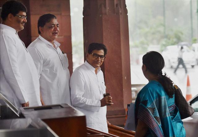 Textile minister Smriti Irani (R) and Samajwadi Party MP Ramgopal Yadav and other members at Parliament House in New Delhi. (PTI Photo) Textile minister Smriti Irani (R) and Samajwadi Party MP Ramgopal Yadav and other members at Parliament House in New Delhi. (PTI Photo)