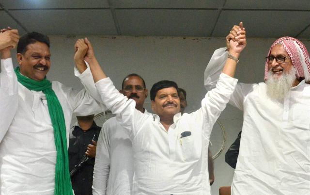 Shivpal Singh Yadav (centre) with Qaumi Ekta Dal president Afzaal Ansari (left) and MLA Sigbatullah Ansari (right) at a press conference in Lucknow. (PTI File Photo) Shivpal Singh Yadav (centre) with Qaumi Ekta Dal president Afzaal Ansari (left) and MLA Sigbatullah Ansari (right) at a press conference in Lucknow. (PTI File Photo)