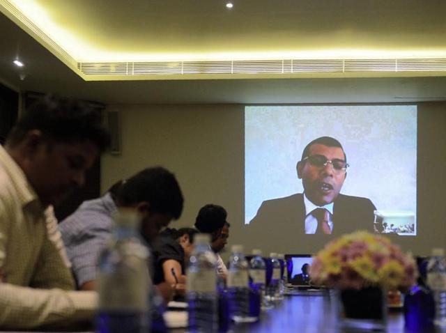 In this photograph taken on Tuesday, exiled Maldives opposition leader Mohamed Nasheed addresses Sri Lanka-based foreign correspondents via video link in Colombo. Nasheed has said he is in talks with the former president who repeatedly threw him in jail to "legally topple" the current leader of the troubled island nation. (AFP) In this photograph taken on Tuesday, exiled Maldives opposition leader Mohamed Nasheed addresses Sri Lanka-based foreign correspondents via video link in Colombo. Nasheed has said he is in talks with the former president who repeatedly threw him in jail to "legally topple" the current leader of the troubled island nation. (AFP)
