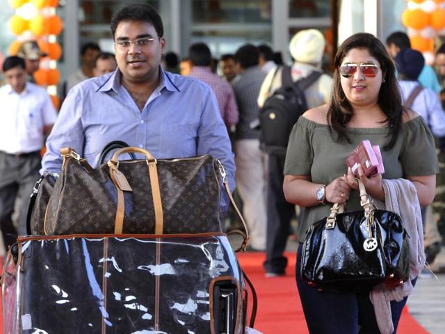 People who arrived in a flight from Sharjah at the Chandigarh international airport on Thursday evening, establishing regular international connectivity of the airport. (Keshav Singh/HT Photo) People who arrived in a flight from Sharjah at the Chandigarh international airport on Thursday evening, establishing regular international connectivity of the airport. (Keshav Singh/HT Photo)