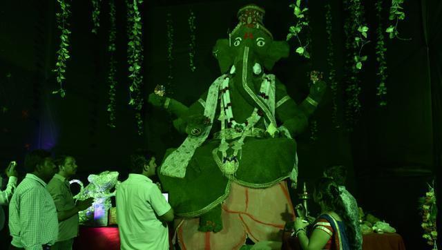 A 22-foot-tall idol of the elephant god made of synthetic grass — a symbol for protecting the environment - at the Shree Ashtavinayak Mitra Mandal, Fort, south Mumbai. (HT photo)
