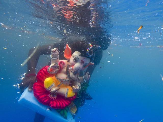 An idol of Lord Ganesha floats after it was immersed in an artificial pond at Sion in Mumbai. (Kunal Patil/HT Photo) An idol of Lord Ganesha floats after it was immersed in an artificial pond at Sion in Mumbai. (Kunal Patil/HT Photo)