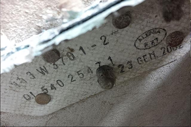 An undated handout photo released by the Australian Transport Safety Board (ATSB) and received on September 15, 2016, shows part number information on a large piece of debris found in Tanzania. (AFP) An undated handout photo released by the Australian Transport Safety Board (ATSB) and received on September 15, 2016, shows part number information on a large piece of debris found in Tanzania. (AFP)