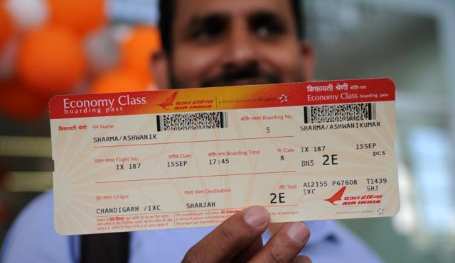 A man shows his boarding pass for the first Chandigarh-Sharjah flight on Thursday. (Anil Dayal/HT Photo)