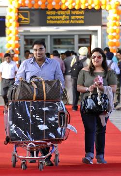 Passengers from Sharjah coming out of Chandigarh International Airport on Thursday. (Keshav Singh/HT Photo) Passengers from Sharjah coming out of Chandigarh International Airport on Thursday. (Keshav Singh/HT Photo)