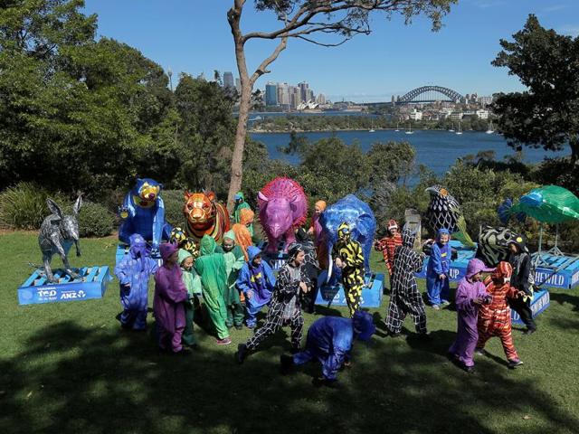 Children wearing outfits representing rare and endangered animal species roam around giant lanterns depicting those animals during the 100th anniversary event. (REUTERS)