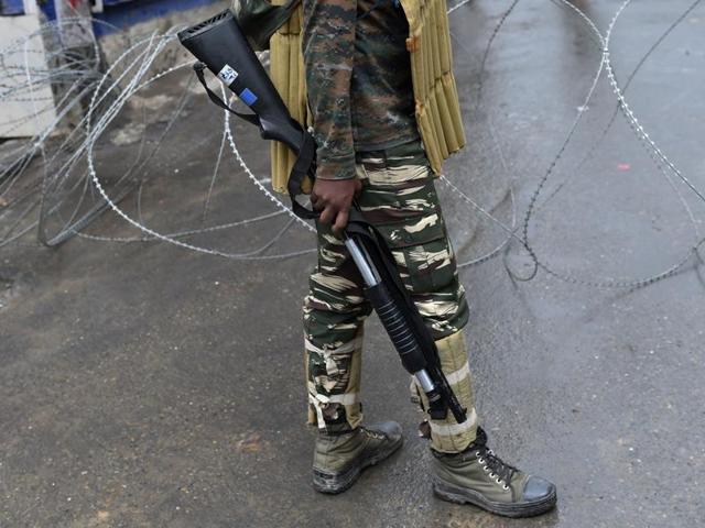 A paramilitary trooper holds a pump action shotgun as he stands guard on a road during a curfew in Srinagar. (AFP File Photo) A paramilitary trooper holds a pump action shotgun as he stands guard on a road during a curfew in Srinagar. (AFP File Photo)