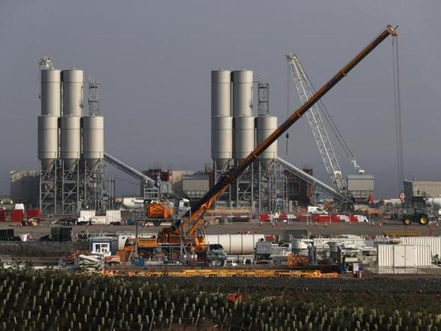 Undated handout image released by EDF Energy shows a computer generated image of the French energy producer's proposed two nuclear reactors, Hinkely Point C (HPC), at their Hinkley Point power plant in southwest England. Britain's government finally gave the green light to the controversial Chinese-backed nuclear power plant on Thursday but with new conditions to address security concerns. (AFP) Undated handout image released by EDF Energy shows a computer generated image of the French energy producer's proposed two nuclear reactors, Hinkely Point C (HPC), at their Hinkley Point power plant in southwest England. Britain's government finally gave the green light to the controversial Chinese-backed nuclear power plant on Thursday but with new conditions to address security concerns. (AFP)
