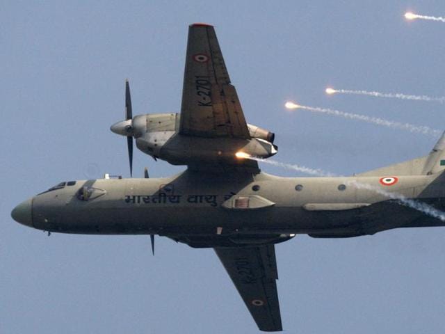 An Indian Air Force AN-32 transport aircraft releases chaff as it flies past the IAF Day Parade in New Delhi.(AP File Photo)