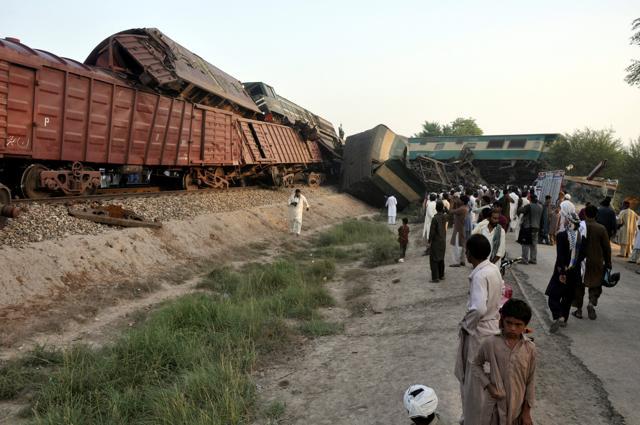 Locals gather at the scene where two trains collided near Multan. (Reuters) Locals gather at the scene where two trains collided near Multan. (Reuters)