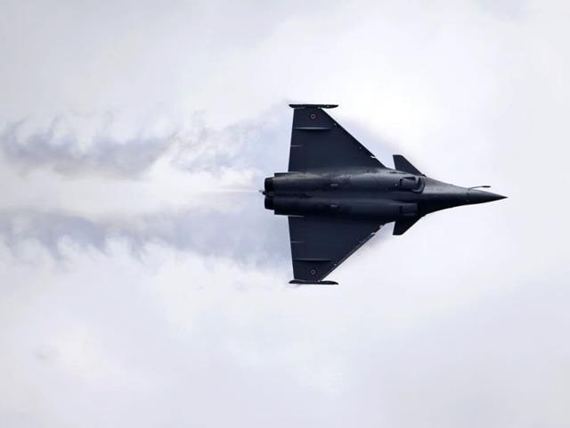 President Francois Hollande and Prime Minister Narendra Modi intervened in the procurement for the Rafale jets in 2015, ordering talks after several years of commercial negotiations with Dassault had collapsed. (AP File Photo) President Francois Hollande and Prime Minister Narendra Modi intervened in the procurement for the Rafale jets in 2015, ordering talks after several years of commercial negotiations with Dassault had collapsed. (AP File Photo)