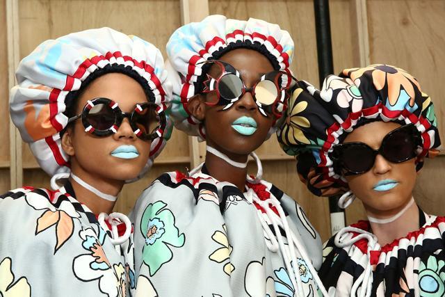 Models pose for photos backstage at Thom Browne show. How cool are these ice-blue frosted lips? (AFP)