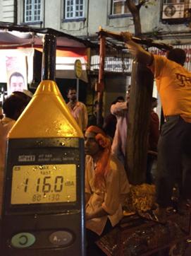 An activist measures noise levels outside Opera House on Thursday night. An activist measures noise levels outside Opera House on Thursday night.