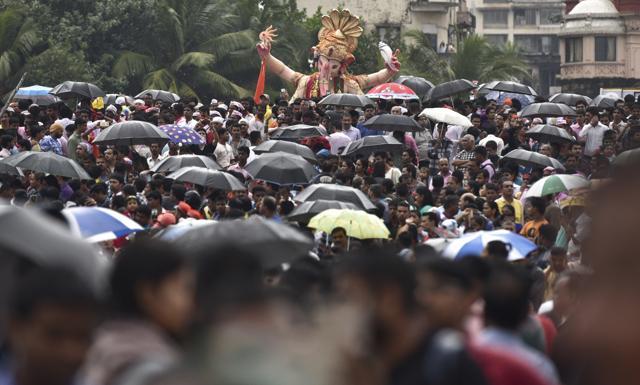 Devotees bid adieu to Bappa at Girgaon Chowpatty on Thursday. (Arijit Sen / HT Photo) Devotees bid adieu to Bappa at Girgaon Chowpatty on Thursday. (Arijit Sen / HT Photo)