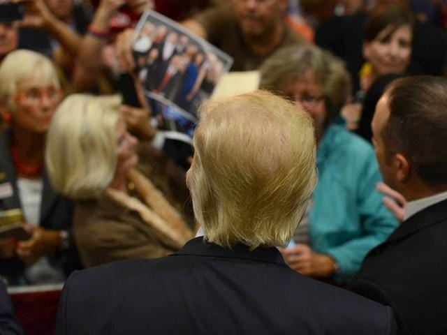 US presidential nominee Donald Trump works the rope line after speaking at Laconia Middle School on September 15 in Laconia, New Hampshire. (AFP) US presidential nominee Donald Trump works the rope line after speaking at Laconia Middle School on September 15 in Laconia, New Hampshire. (AFP)