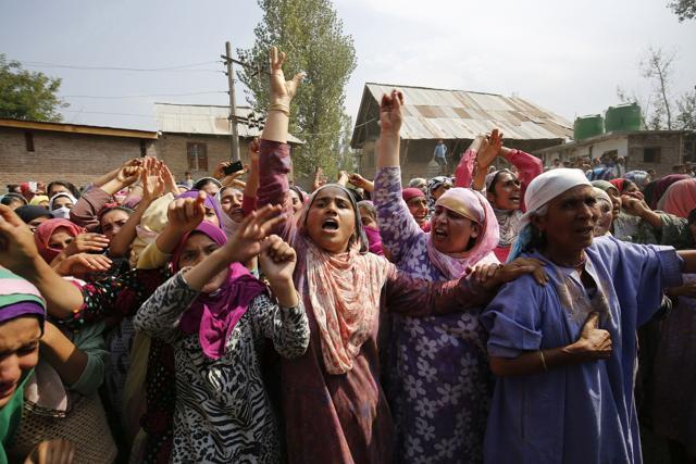 Kashmiri women shout pro-freedom slogans during a funeral procession of a Javed Ahmad Dar at Wadwan Budgam, some 20kms from Srinagar, Jammu and Kashmir, on Sunday,11 September 2016.Dar was injured after being hit by a bullet in his leg on 05 August 2016 during clashes. (Waseem Andrabi / HT Photo) Kashmiri women shout pro-freedom slogans during a funeral procession of a Javed Ahmad Dar at Wadwan Budgam, some 20kms from Srinagar, Jammu and Kashmir, on Sunday,11 September 2016.Dar was injured after being hit by a bullet in his leg on 05 August 2016 during clashes. (Waseem Andrabi / HT Photo)